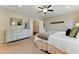 The main bedroom features a large dresser, decor, and a plush bed at 3172 Havencroft Ne Dr, Roswell, GA 30075