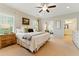 Bright main bedroom with many windows, features ensuite bathroom and connected seating area at 3172 Havencroft Ne Dr, Roswell, GA 30075