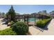 Beautiful community pool area with lounge chairs, landscaping, and iron fencing at 3172 Havencroft Ne Dr, Roswell, GA 30075