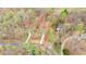 Aerial view of property with a well defined lot line and surrounding trees at 7170 Highbrook E Cir, Cumming, GA 30041