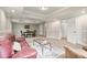 Finished basement area with a comfortable seating area and additional dining space, perfect for entertaining guests at 7170 Highbrook E Cir, Cumming, GA 30041