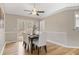Cozy dining room featuring hardwood floors, crown molding, and French doors to the back deck at 7170 Highbrook E Cir, Cumming, GA 30041