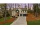 Charming two-story home with a welcoming front porch, two-car garage, and well-maintained landscaping at 7170 Highbrook E Cir, Cumming, GA 30041