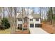 Charming two-story home with a welcoming front porch, two-car garage, and well-maintained landscaping at 7170 Highbrook E Cir, Cumming, GA 30041