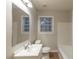 Bathroom featuring a single sink, toilet, bathtub, and mirror, ready for modernization at 1753 Beechwood Sw Blvd, Atlanta, GA 30311