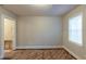 Bedroom featuring hardwood flooring and a window letting in natural light at 1753 Beechwood Sw Blvd, Atlanta, GA 30311