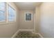 Small bedroom featuring a window and whitewashed brick, perfect for a cozy retreat at 1753 Beechwood Sw Blvd, Atlanta, GA 30311