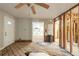 Open-concept potential with exposed beams and view into the kitchen area, ready for renovation at 1753 Beechwood Sw Blvd, Atlanta, GA 30311