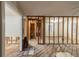 Spacious living room undergoing renovations with exposed beams and hardwood flooring at 1753 Beechwood Sw Blvd, Atlanta, GA 30311
