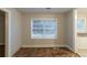 Bright room with a window and doorway, awaiting flooring and your design ideas at 1753 Beechwood Sw Blvd, Atlanta, GA 30311