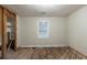 Empty room with window and exposed floor, ready for transformation to suit your needs at 1753 Beechwood Sw Blvd, Atlanta, GA 30311