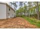 Spacious backyard with a grassy area, ideal for outdoor activities and entertaining at 214 Walton St, Loganville, GA 30052