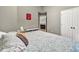 Relaxing bedroom with neutral tones, a full bed, and a decorative art piece at 214 Walton St, Loganville, GA 30052
