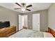 Comfortable bedroom features a ceiling fan, good light, and neutral walls at 214 Walton St, Loganville, GA 30052