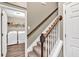 Stairway landing showing carpeted stairs and a laundry room with washer and dryer at 214 Walton St, Loganville, GA 30052