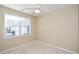 Bright bedroom with plush carpeting, ceiling fan, and a large window for natural light at 2368 Barrett Cottage # 17, Marietta, GA 30066