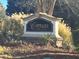 Community sign for The Cottages at Bells Ferry, surrounded by manicured landscaping at 2368 Barrett Cottage # 17, Marietta, GA 30066