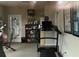 A gym with workout equipment, offering residents a convenient fitness space at 2368 Barrett Cottage # 17, Marietta, GA 30066