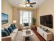Cozy living room with plush seating, a large window, and modern decor, perfect for relaxation at 2368 Barrett Cottage # 17, Marietta, GA 30066