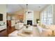 Bright living room featuring a fireplace, vaulted ceilings, hardwood floors, and modern white furnishings at 2368 Barrett Cottage # 17, Marietta, GA 30066