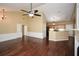 Open-concept living space featuring hardwood floors, kitchen bar, and adjoining dining area at 2368 Barrett Cottage # 17, Marietta, GA 30066