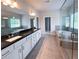 Primary bathroom with double vanities, soaking tub, and glass-enclosed shower at 3292 Lions Ruby Ln, Atlanta, GA 30349