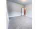 Bright bedroom featuring neutral paint, a doorway, and pristine white trim at 3292 Lions Ruby Ln, Atlanta, GA 30349