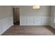 Classic dining room features chair rail, wood floors, and modern light fixture at 3292 Lions Ruby Ln, Atlanta, GA 30349