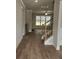 Inviting entryway with staircase and hardwood floors leads to bright living space at 3292 Lions Ruby Ln, Atlanta, GA 30349