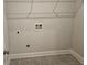Bright laundry room featuring tiled floors, and utility connections ready for modern appliances at 3292 Lions Ruby Ln, Atlanta, GA 30349