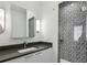Bathroom featuring a modern vanity with solid surface top and tiled shower with glass door at 728 Oakview Rd, Decatur, GA 30030