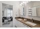 Bright bathroom with a double sink vanity, modern fixtures, and open doorway to a living space at 728 Oakview Rd, Decatur, GA 30030
