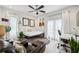 Bright bedroom with white walls, wood floors, a ceiling fan, and French doors for natural light at 728 Oakview Rd, Decatur, GA 30030