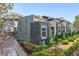 Modern townhome with sleek gray and brick facade, professional landscaping, and private drive at 728 Oakview Rd, Decatur, GA 30030