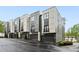 Modern townhome complex with sleek architectural design and individual garages for convenient parking at 728 Oakview Rd, Decatur, GA 30030