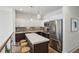 Modern kitchen featuring stainless steel appliances, tiled backsplash, and a quartz countertop island with seating at 728 Oakview Rd, Decatur, GA 30030
