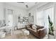 Bright living room with a modern desk, comfortable couch, large windows and stylish decor at 728 Oakview Rd, Decatur, GA 30030