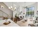 Open floor plan features high ceilings, modern lighting, a staircase with metal railings, and luxury decor at 728 Oakview Rd, Decatur, GA 30030