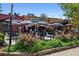 Universal Joint restaurant with a lively outdoor patio seating area surrounded by lush landscaping at 728 Oakview Rd, Decatur, GA 30030