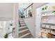 Staircase with wood steps and metal railings leading to a brightly lit living area at 728 Oakview Rd, Decatur, GA 30030