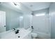 Bright bathroom featuring a white vanity, toilet, and a tiled shower/tub combo at 5712 Kendrick Ln, Cumming, GA 30041