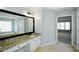 Bathroom featuring granite countertops, and view to the main bedroom at 5712 Kendrick Ln, Cumming, GA 30041