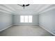 Spacious bedroom features a ceiling fan and large windows for ample natural light at 5712 Kendrick Ln, Cumming, GA 30041