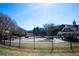 Community pool with a lounging area behind a wrought iron fence at 5712 Kendrick Ln, Cumming, GA 30041