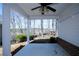 Covered patio with a ceiling fan offers views of the wooded surroundings at 5712 Kendrick Ln, Cumming, GA 30041