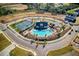 Aerial view of community pool, tennis courts and surrounding homes at 6470 Pond View Dr, Cumming, GA 30028