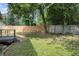 Backyard featuring a wooden fence with mature trees and green space at 972 Sims Nw Ave, Atlanta, GA 30318