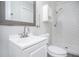 Well-lit bathroom featuring vanity, tiled shower, and modern fixtures at 972 Sims Nw Ave, Atlanta, GA 30318