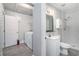 Bathroom featuring shower, vanity, and tile flooring, next to the laundry room at 972 Sims Nw Ave, Atlanta, GA 30318