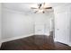 Comfortable bedroom featuring hardwood floors and a charming decorative fireplace at 972 Sims Nw Ave, Atlanta, GA 30318